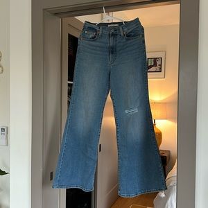 Levi's Ribcage bell bottoms, 29w 32L, distressed, knee.